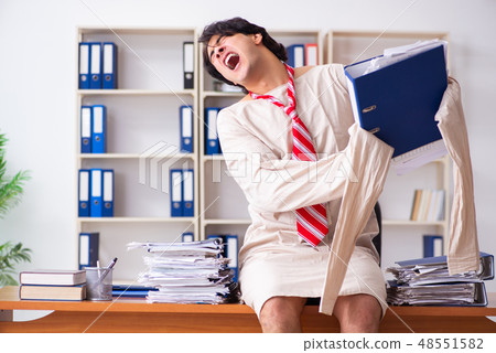 Crazy young man in straitjacket at the office  48551582