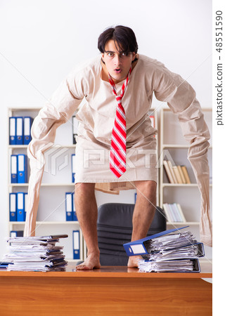 Crazy young man in straitjacket at the office  48551590