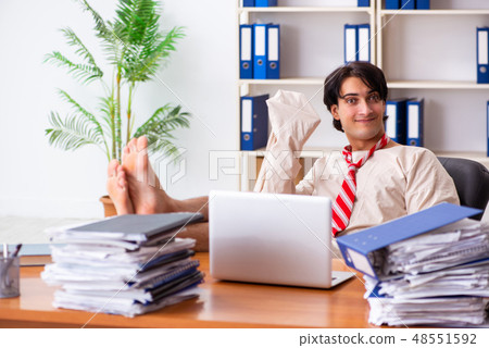 Crazy young man in straitjacket at the office Crazy young man in straitjacket at the office 48551592