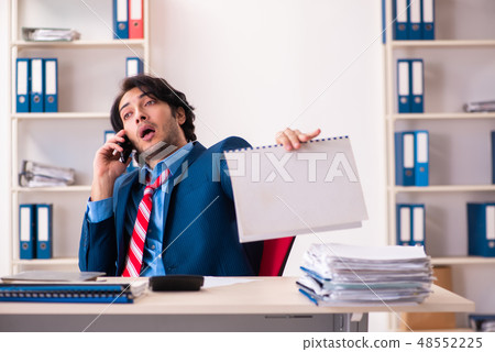 Young handsome businessman sitting in the office  48552225