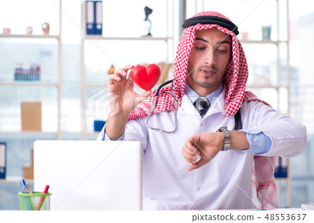 Arab doctor cardiologist working in the clinic  48553637