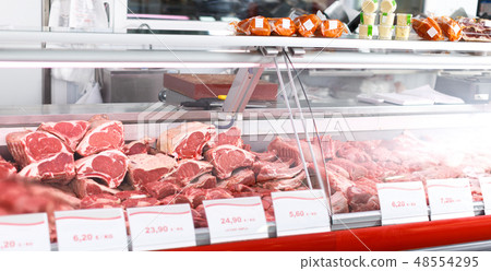 Meat displayed for sale in shop 48554295
