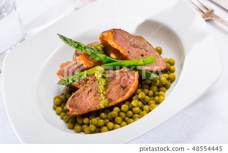 Duck breast with green pea and asparagus Duck breast with green pea and asparagus 48554445