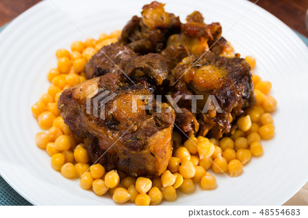 Oxtail stew with chickpeas - traditional Spanish dish Oxtail stew with chickpeas - traditional Spanish dish 48554683
