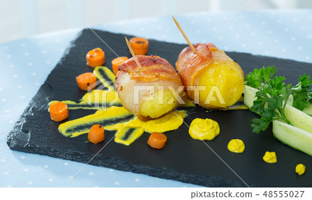 Bacon wrapped potatoes with sauce Bacon wrapped potatoes with sauce 48555027