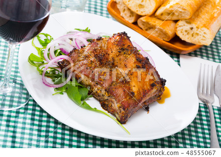 Rack of pork with greens Rack of pork with greens 48555067