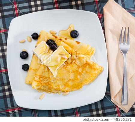 Pancakes with cheese brie and honey Pancakes with cheese brie and honey 48555121