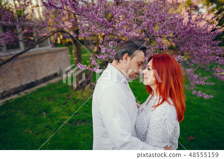 elegant family in a park 48555159