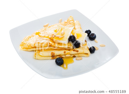 Crepes with brie and honey Crepes with brie and honey 48555189