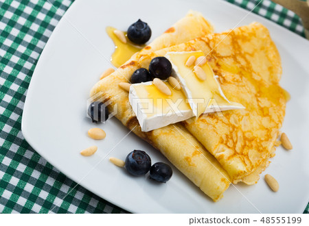 Crepes with brie and honey Crepes with brie and honey 48555199