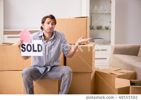Young man selling his house Young man selling his house 48555502