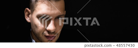 Tricky sly man face in dark room 48557430