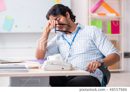 Young handsome male designer working in the office  48557980