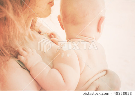 Baby at hands mother Protective cream for moisture Baby at hands mother Protective cream for moisture 48558938