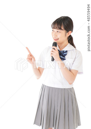 A student speaking with a microphone A student speaking with a microphone 48559494