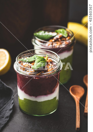 Acai berry layer smoothie in jar Acai berry layer smoothie in jar 48560367