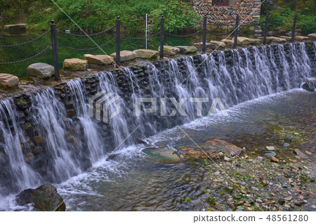 Beautiful waterfall under stone road in mountain Beautiful waterfall under stone road in mountain 48561280