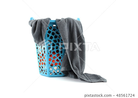 Colorful clothes in a laundry basket isolated on w 48561724