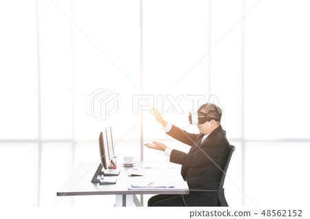 Businessmen viewing the contents of VR device.. Businessmen viewing the contents of VR device.. 48562152