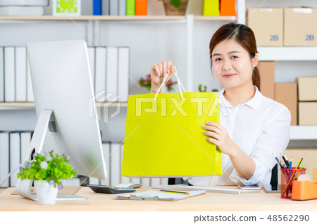 Business woman working in startup office. Business woman working in startup office. 48562290