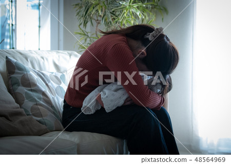 Mother holding a baby child rearing neurosis postpartum depression 48564969