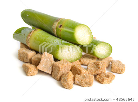 Sugar cane and brown sugar. Isolated on white 48565645
