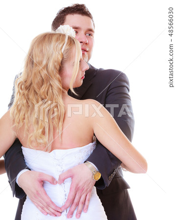 Happy groom and bride posing for marriage photo Happy groom and bride posing for marriage photo 48566030