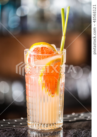 Paloma cocktail tequila drink with grapefruit at barcounter in night club or restaurant Paloma cocktail tequila drink with grapefruit at barcounter in night club or restaurant 48568121