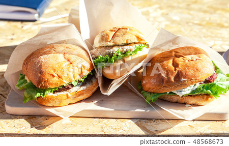 Hamburgers with beef meat and fresh salad 48568673
