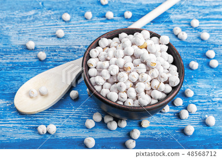 chickpeas in a bowl on a wooden background chickpeas in a bowl on a wooden background 48568712
