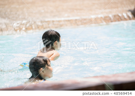 Children playing in the summer 48569454