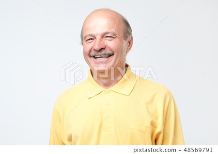 Mature adult man laughing looking at the camera  48569791