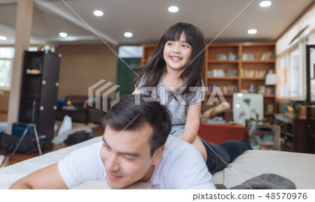 little girl daughter playing with father little girl daughter playing with father 48570976