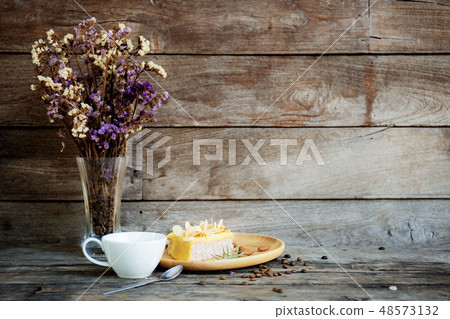 Coffee cup and vase at wall. Coffee cup and vase at wall. 48573132