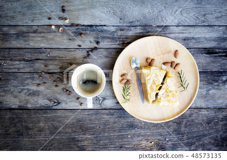 Coffee cup and cake on table. Coffee cup and cake on table. 48573135