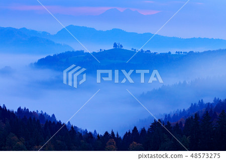 Twilight with fog in Slovenia. Saint Thomas Church 48573275