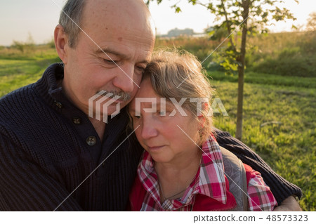 Sad elderly couple. Coping with problems together. 48573323