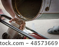 Farmer fill water into water pump engine 48573669