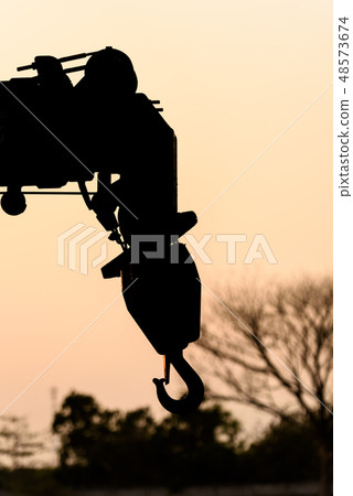 silhouette hook of crane sunset background silhouette hook of crane sunset background 48573674