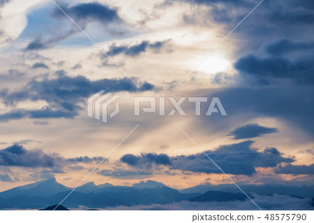 Beautiful distant winter mountains and skyscape with mist 48575790