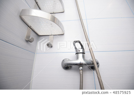 Close up part of used stainless steel shower in bathroom 48575925