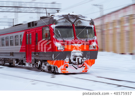 ice-covered multiple-unit train rides in winter 48575937