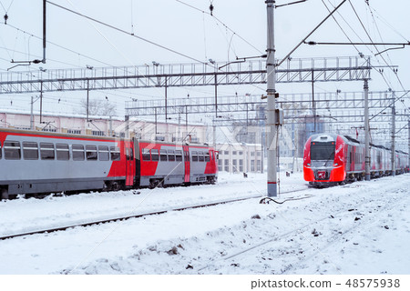 ice-covered multiple-unit trains at the station ice-covered multiple-unit trains at the station 48575938