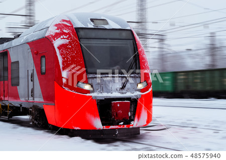 ice-covered multiple-unit train rides in winter 48575940