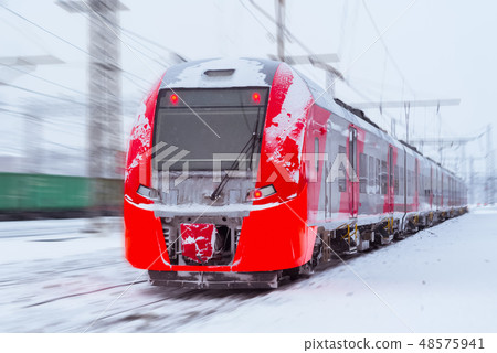 ice-covered multiple-unit train rides in winter 48575941