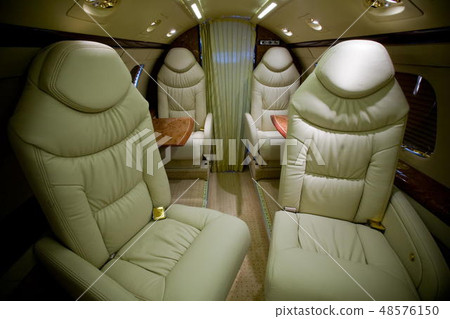 Luxury interior in bright colors of genuine leather in the business jet Luxury interior in bright colors of genuine leather in the business jet 48576150