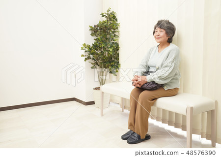 Medical senior female waiting room Medical senior female waiting room 48576390