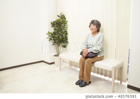 Medical senior female waiting room Medical senior female waiting room 48576391