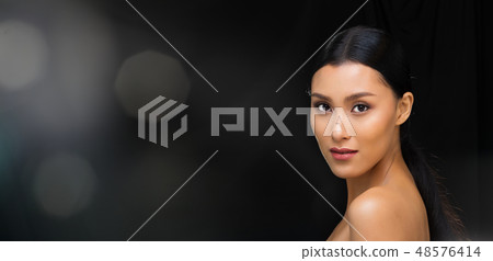 Asian Woman after applying make up hair style 48576414