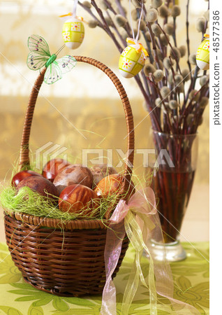 Painted Easter eggs and pussy willow. 48577386